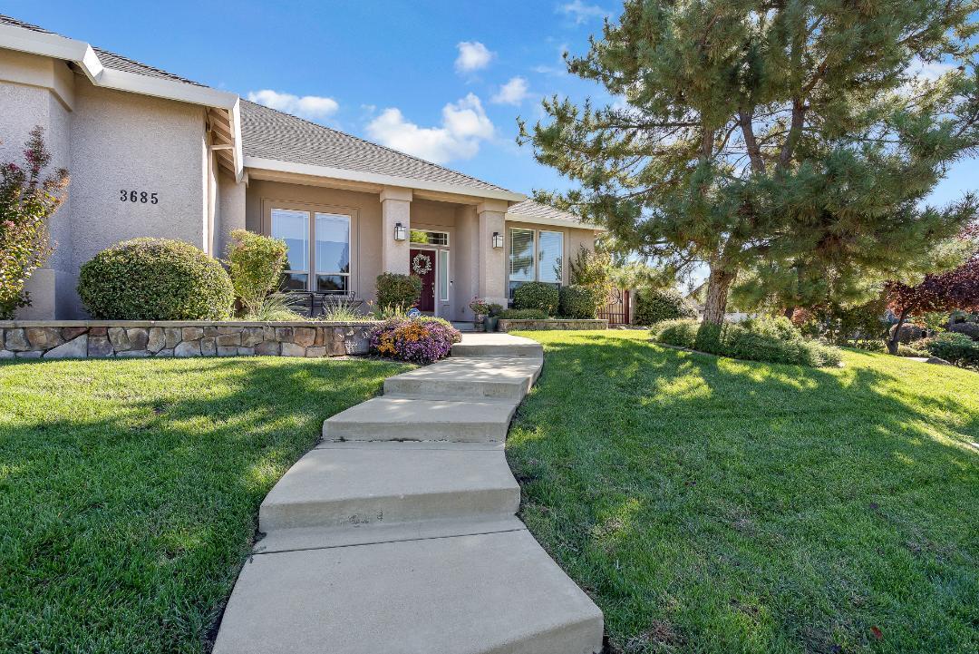 3685 Wimbledon Drive Redding, CA 96002 - Photo 68 of 70 a front view of a house with a yard and porch