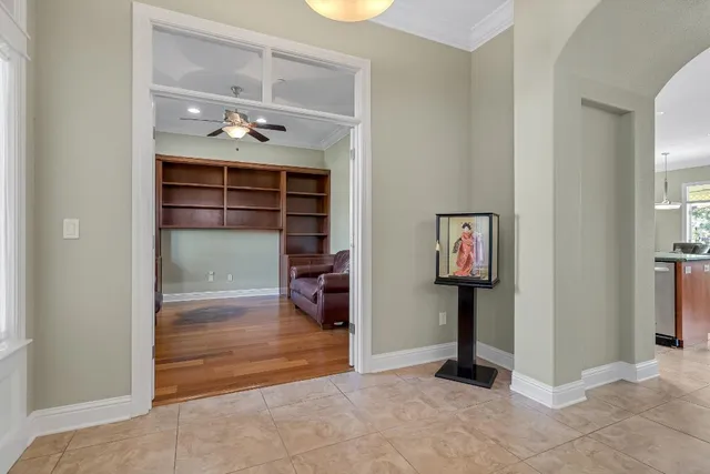 a living room with furniture fireplace and a large window