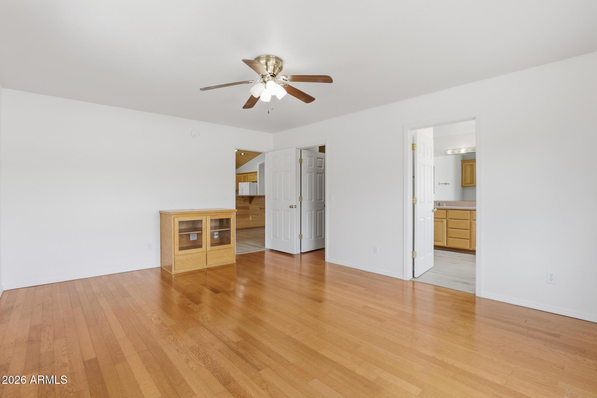 8780 Singletree Lane Payson, AZ 85541 - Photo 15 of 37 a view of an empty room with wooden floor