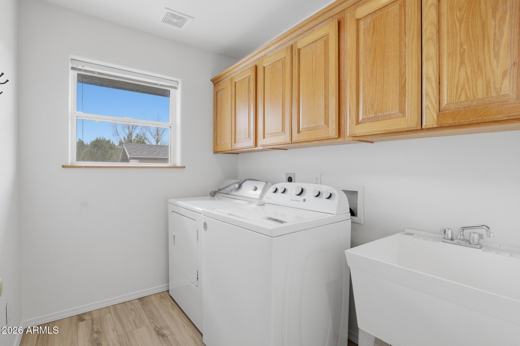 8780 Singletree Lane Payson, AZ 85541 - Photo 23 of 37 a utility room with dryer and washer
