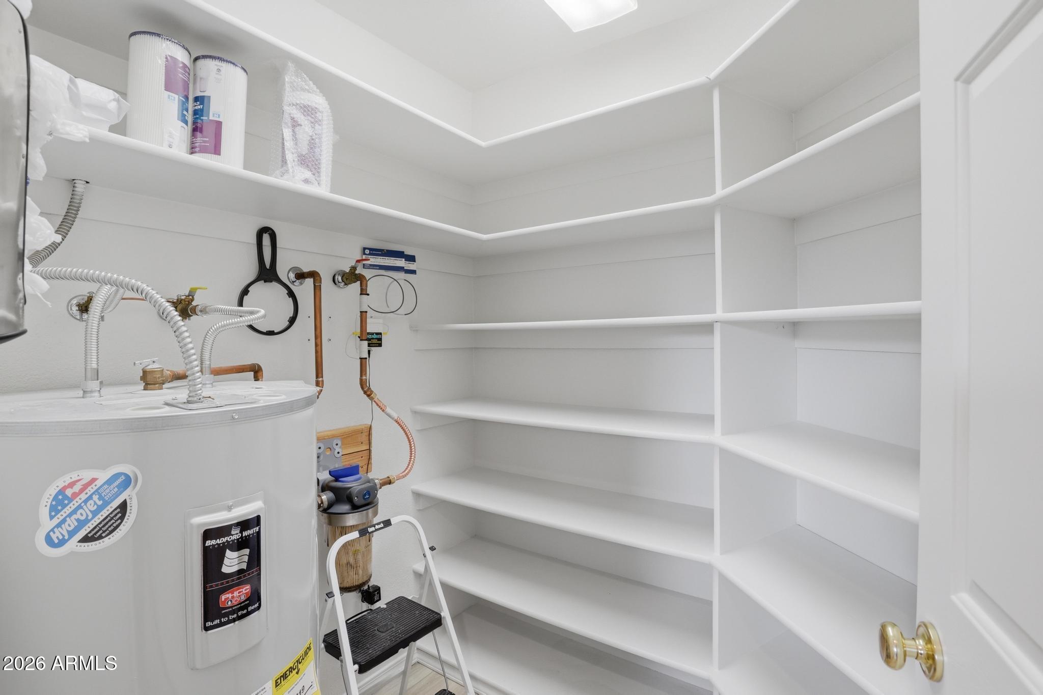 8780 Singletree Lane Payson, AZ 85541 - Photo 24 of 37 a utility room with cabinets dryer and washer