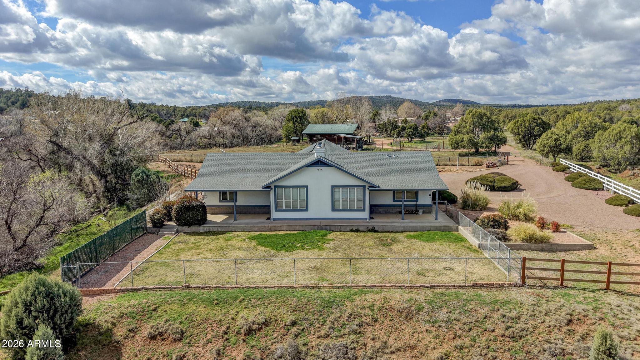 8780 Singletree Lane Payson, AZ 85541 - Photo 29 of 37 a view of a house with a big yard and large tree