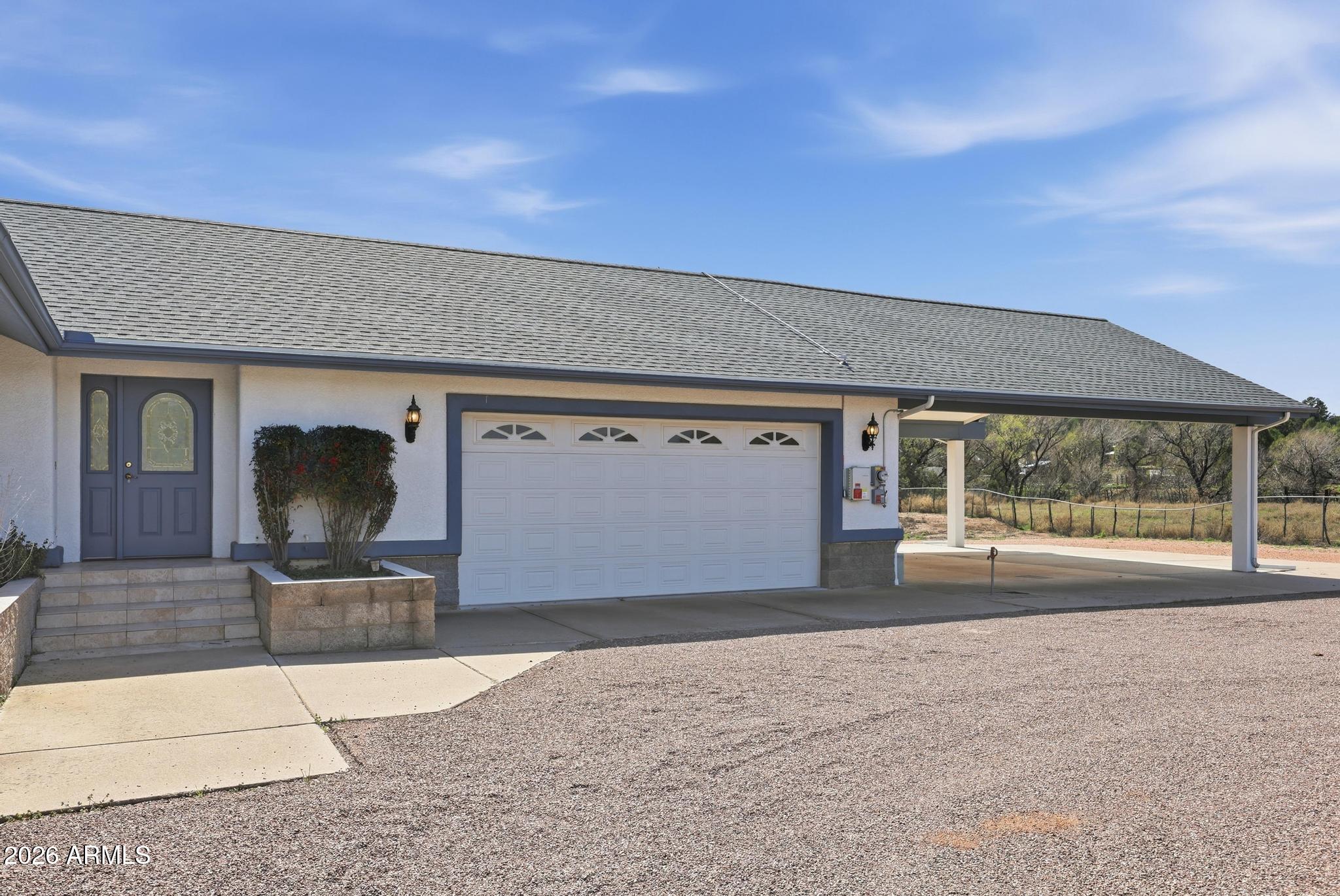 8780 Singletree Lane Payson, AZ 85541 - Photo 4 of 37 a front view of a house with a yard