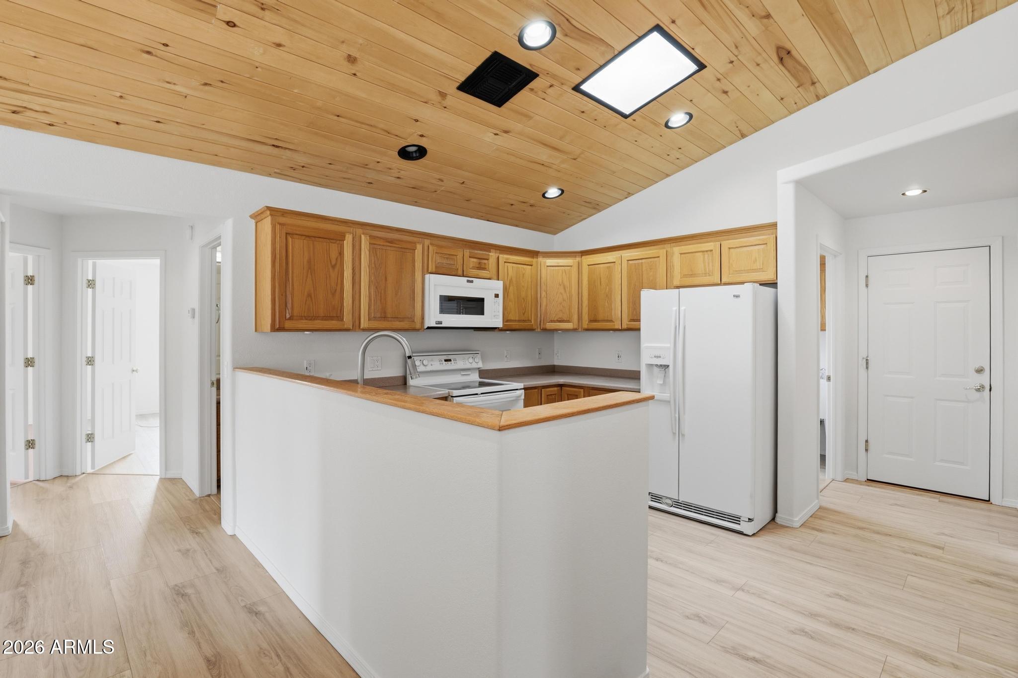 8780 Singletree Lane Payson, AZ 85541 - Photo 8 of 37 a kitchen with stainless steel appliances a refrigerator sink and microwave