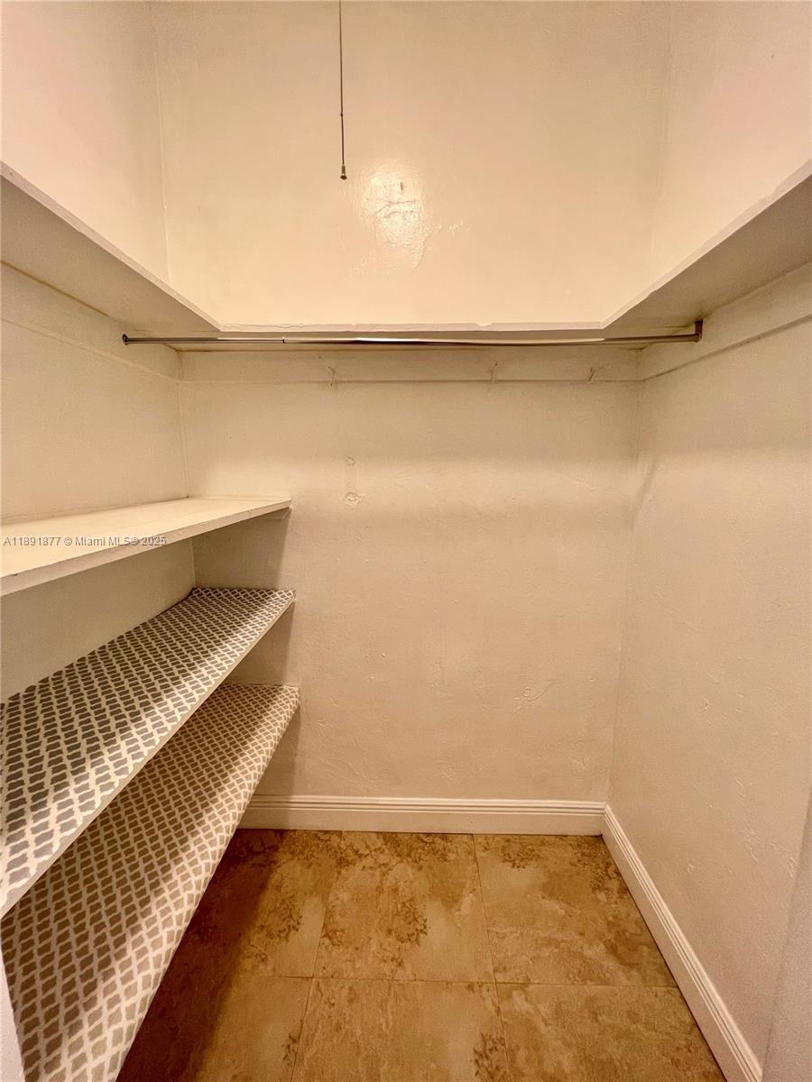 1141 Meridian Avenue, Unit 6 Miami Beach, FL 33139 - Photo 10 of 11 a view of a room with wooden floor and bench