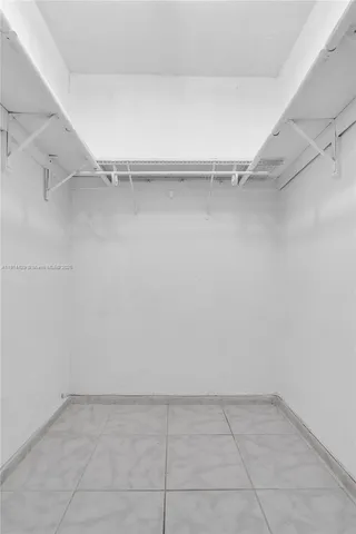 a view of an empty walk in closet