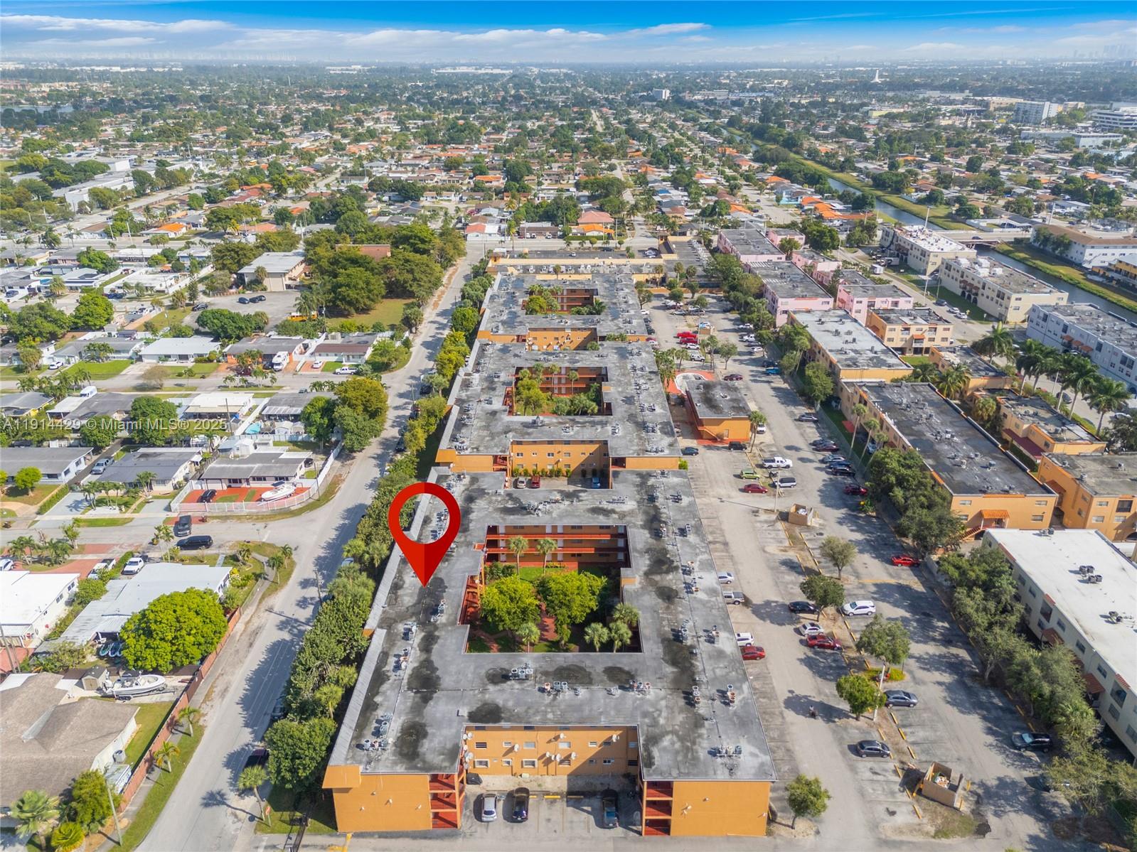 1330 West 54th Street, Unit 302C Hialeah, FL 33012 - Photo 17 of 20 an aerial view of residential houses with outdoor space