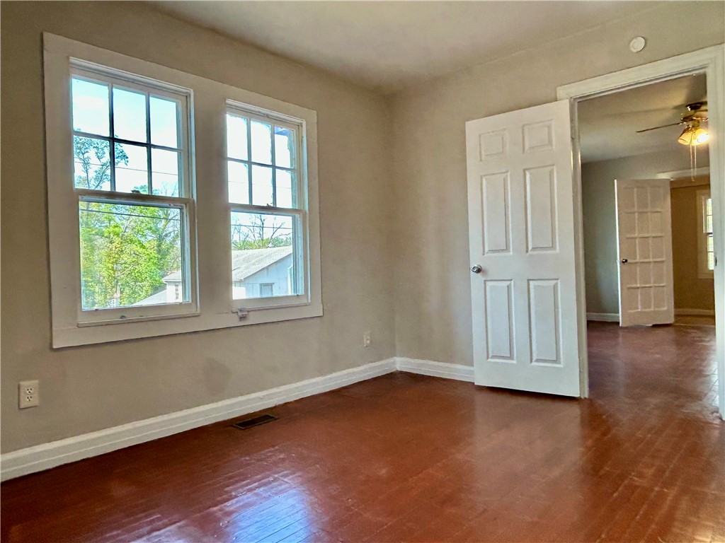 181 Sumter Street Anderson, SC 29621 - Photo 12 of 17 This airy room offers ample natural light and a classic aesthetic.