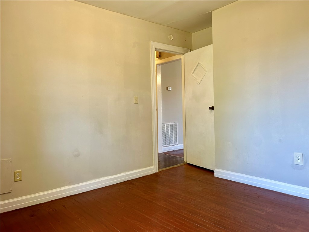 181 Sumter Street Anderson, SC 29621 - Photo 13 of 17 This cozy bedroom features durable hardwood flooring, perfect for comfortable living.