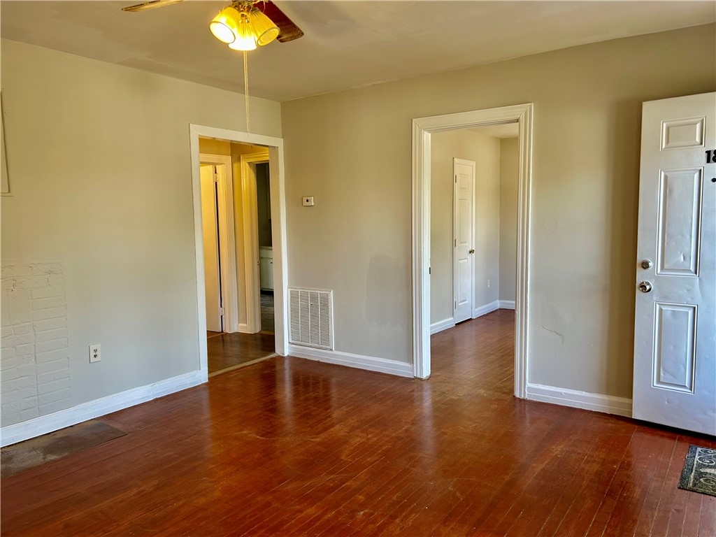 181 Sumter Street Anderson, SC 29621 - Photo 4 of 17 This interior space features beautiful hardwood floors and convenient access to other rooms.