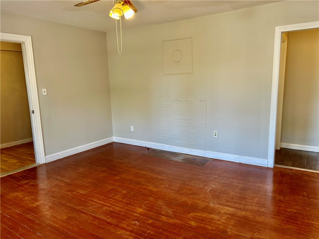 181 Sumter Street Anderson, SC 29621 - Photo 9 of 17 This inviting room features warm wood flooring, offering a comfortable and versatile living space.