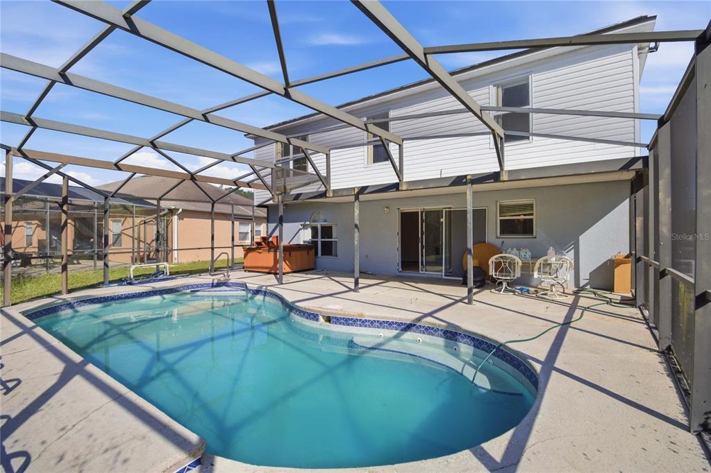 206 Taranto Way Kissimmee, FL 34758 - Photo 37 of 45 a view of a swimming pool with a patio