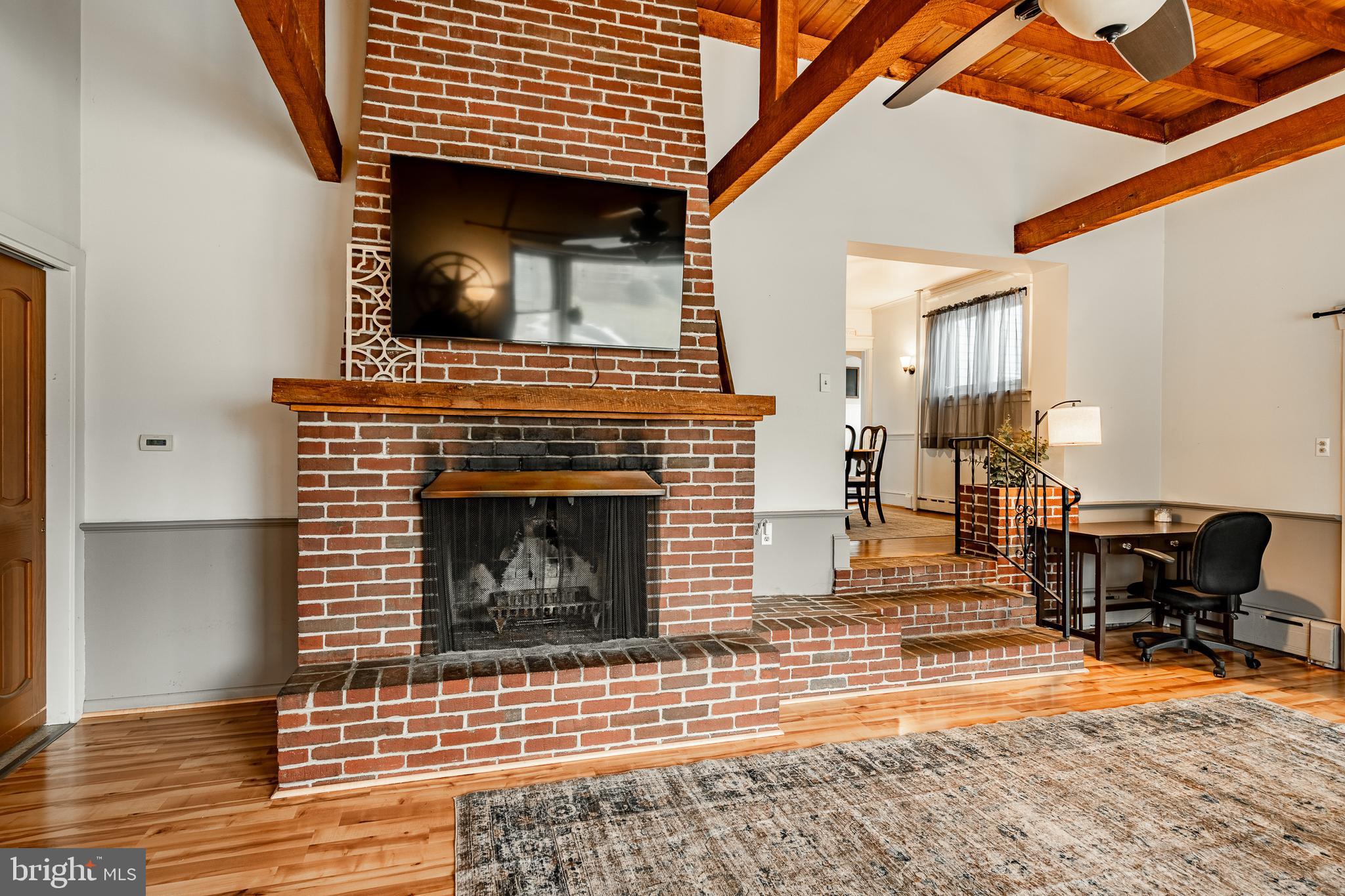 36 Fairview Street Boyertown, PA 19512 - Photo 23 of 40 a living room with a fireplace a rug and a fireplace