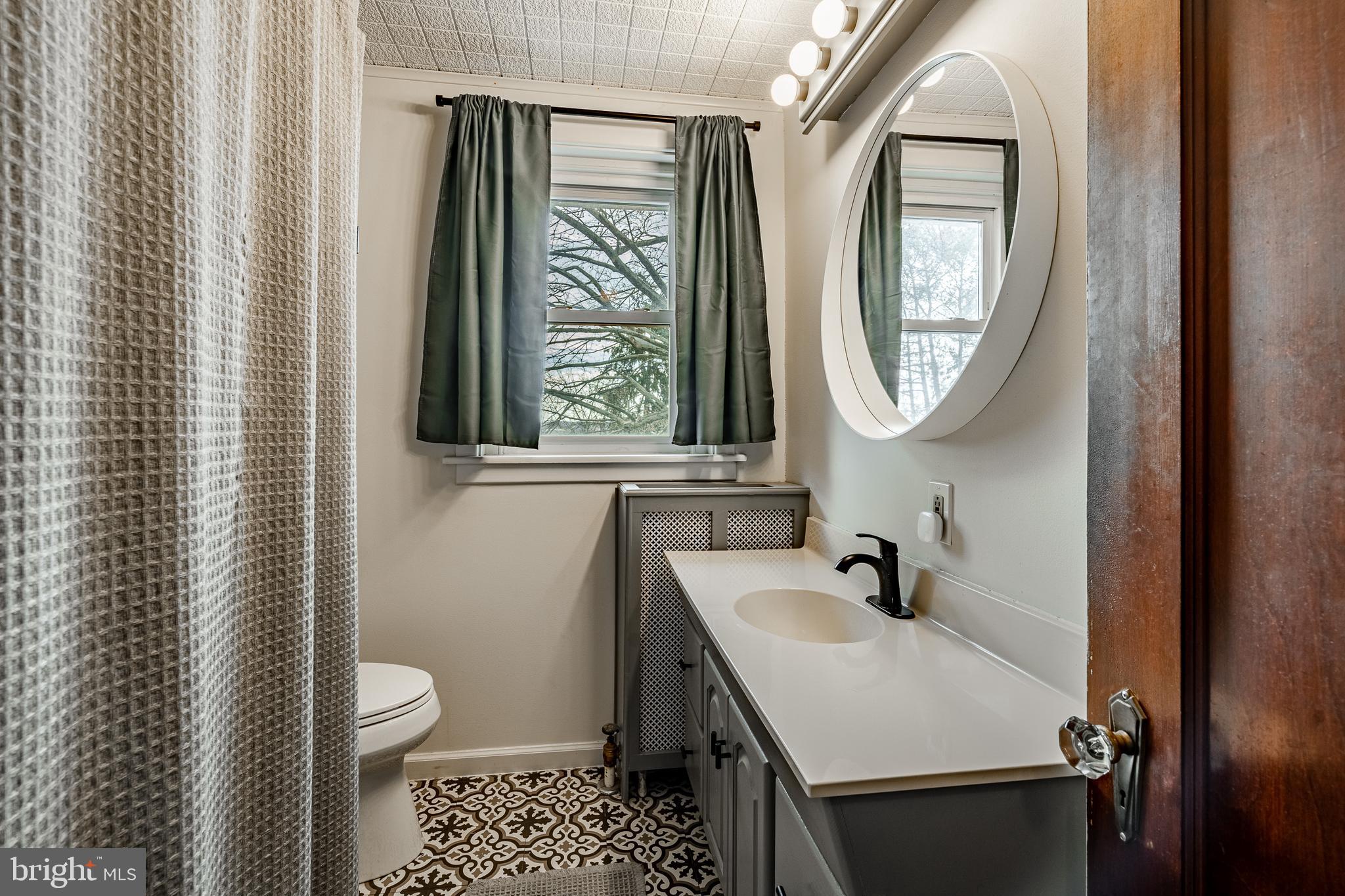36 Fairview Street Boyertown, PA 19512 - Photo 26 of 40 a bathroom with a sink toilet and a mirror