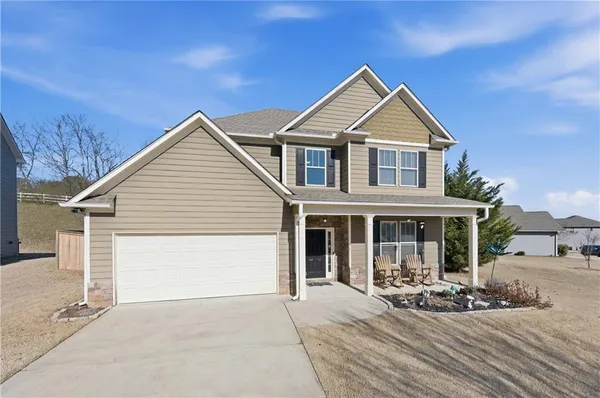 a front view of a house with sitting area