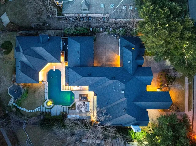 an aerial view of a house with garden space and sitting space