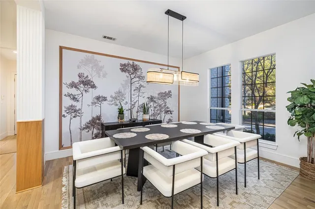 a dining room with furniture and window