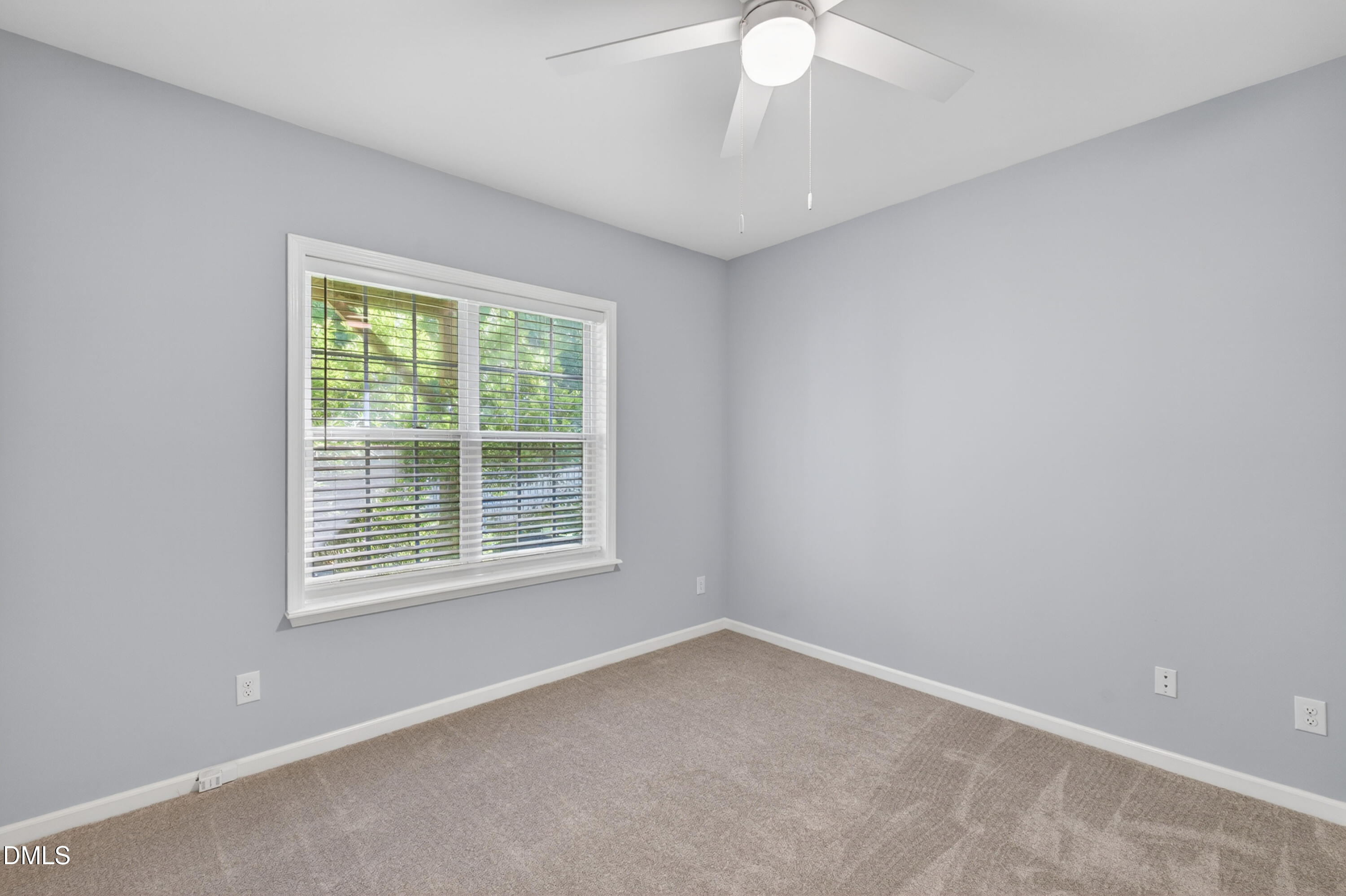 5421 Golden Arrow Lane Raleigh, NC 27613 - Photo 11 of 49 an empty room with a window