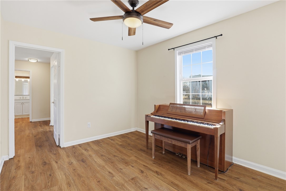 2703 Dellwood Lane Anderson, SC 29621 - Photo 18 of 26 Open bonus space between the primary and secondary bedrooms, features a closet and access to bathroom #3.