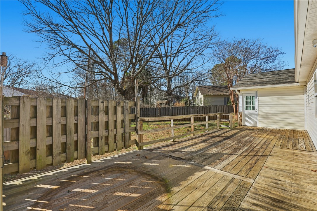 2703 Dellwood Lane Anderson, SC 29621 - Photo 21 of 26 The sunroom and primary bedroom lead to the deck.