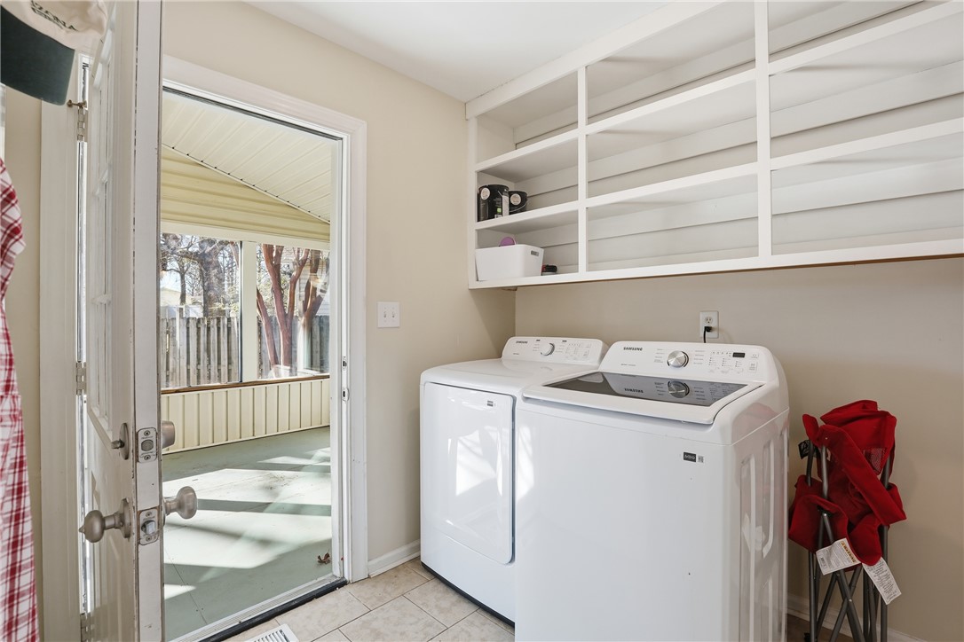 2703 Dellwood Lane Anderson, SC 29621 - Photo 9 of 26 The laundry room is directly off the kitchen and leads to the sunroom.