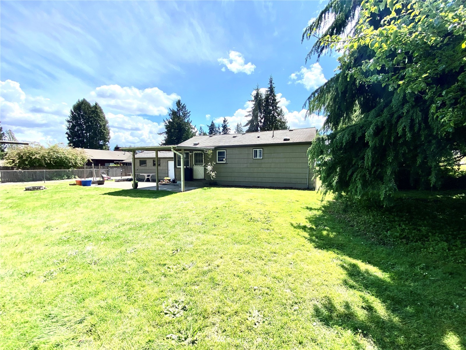 9232 Northeast 180th Street Bothell, WA 98011 - Photo 12 of 12 a view of a swimming pool with a yard