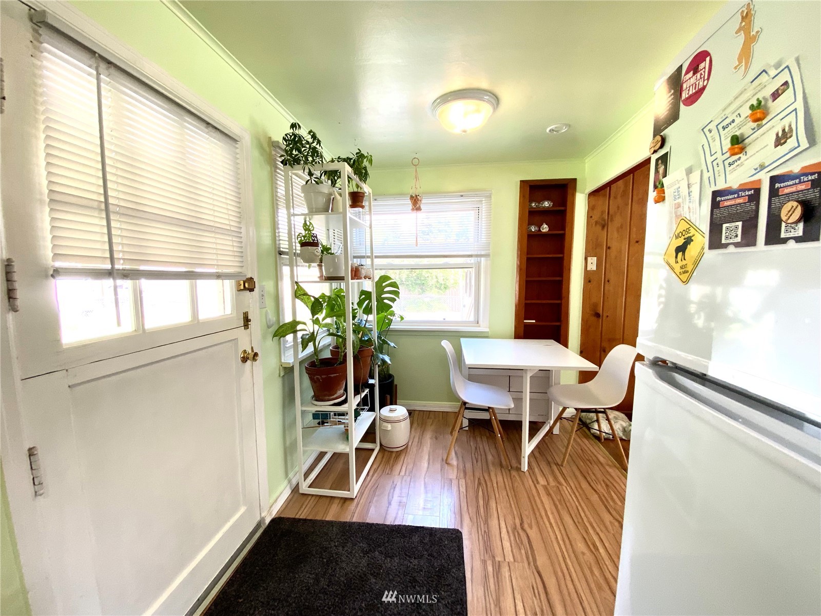 9232 Northeast 180th Street Bothell, WA 98011 - Photo 5 of 12 a view of a dining room with furniture and wooden floor