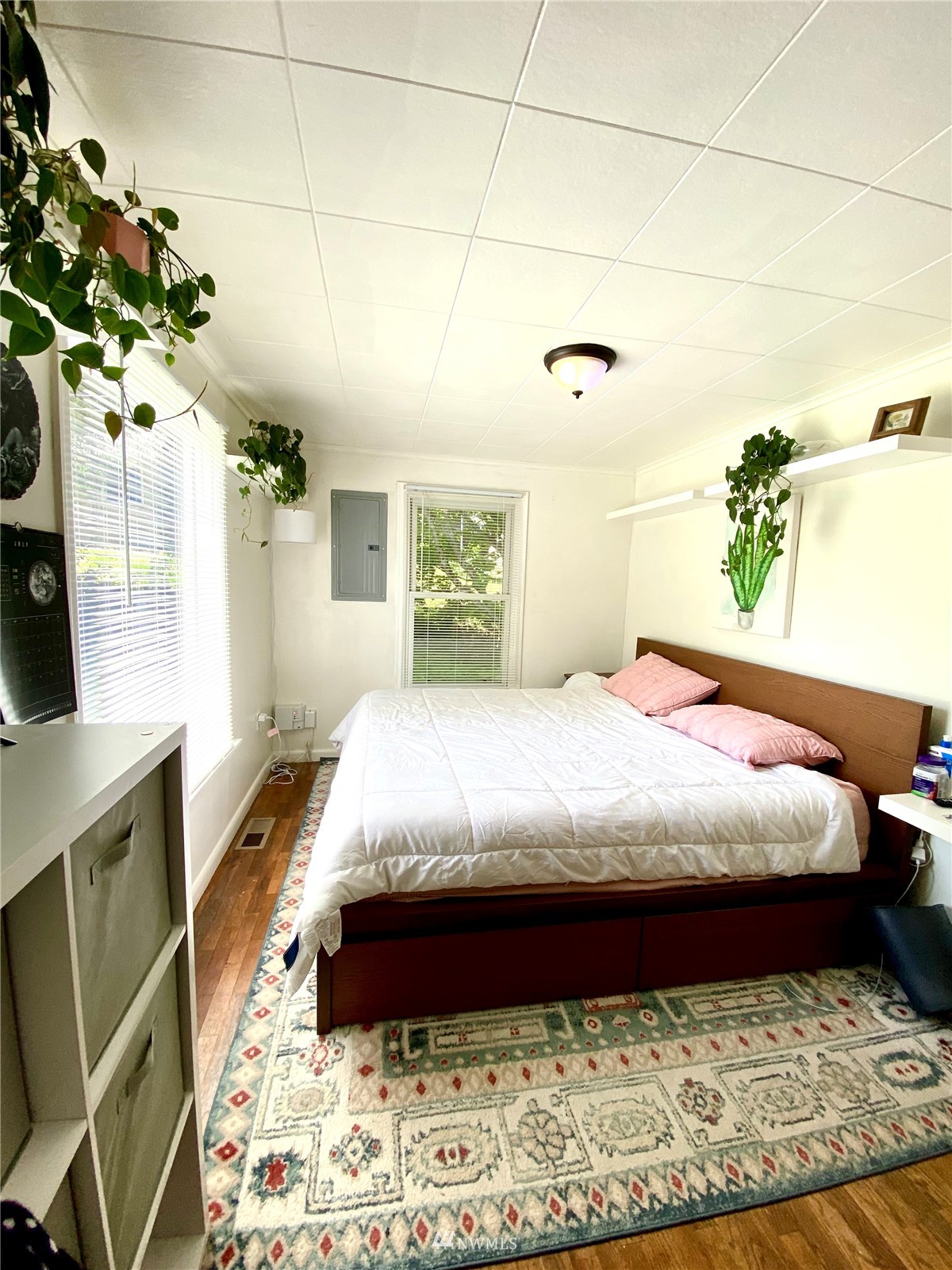 9232 Northeast 180th Street Bothell, WA 98011 - Photo 7 of 12 a bed sitting in a bedroom next to a window