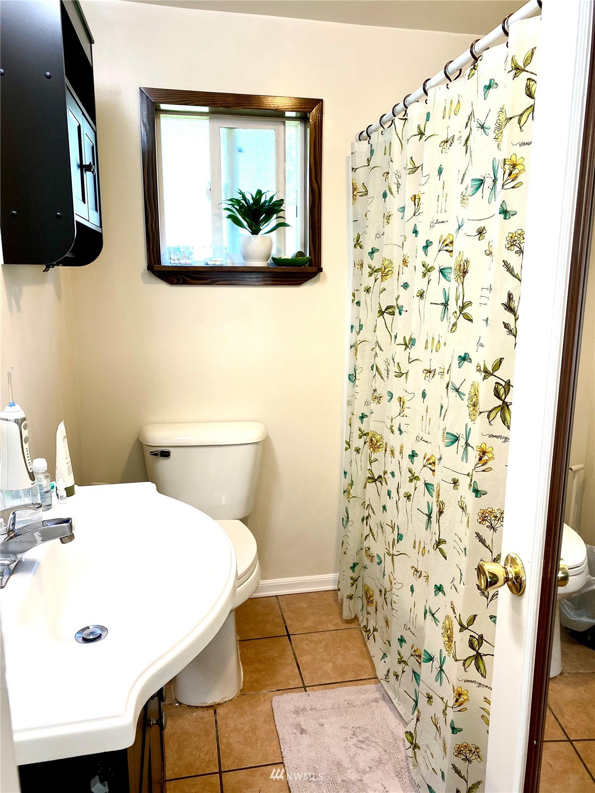9232 Northeast 180th Street Bothell, WA 98011 - Photo 8 of 12 a bathroom with a sink and a toilet