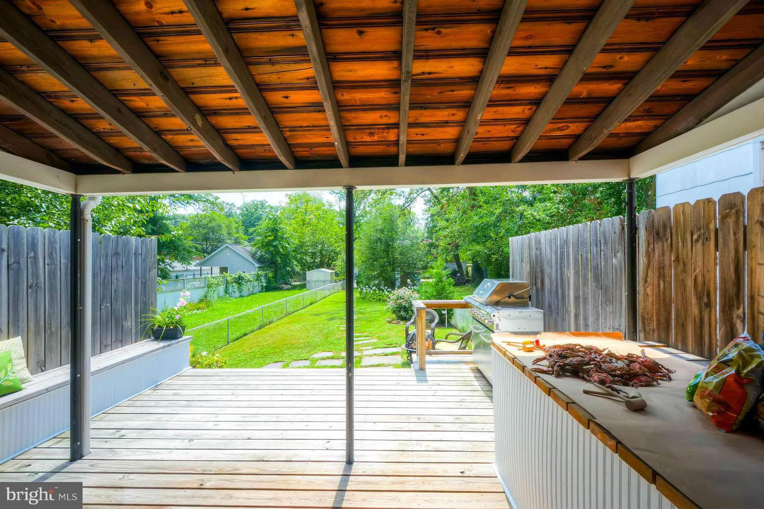 1615 Mussula Road Towson, MD 21286 - Photo 20 of 30 a view of a patio with table and chairs and wooden floor