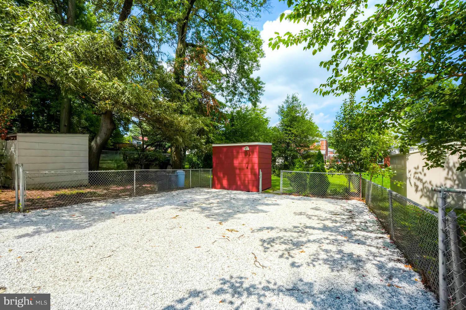 1615 Mussula Road Towson, MD 21286 - Photo 27 of 30 a backyard of a house with trees and outdoor seating