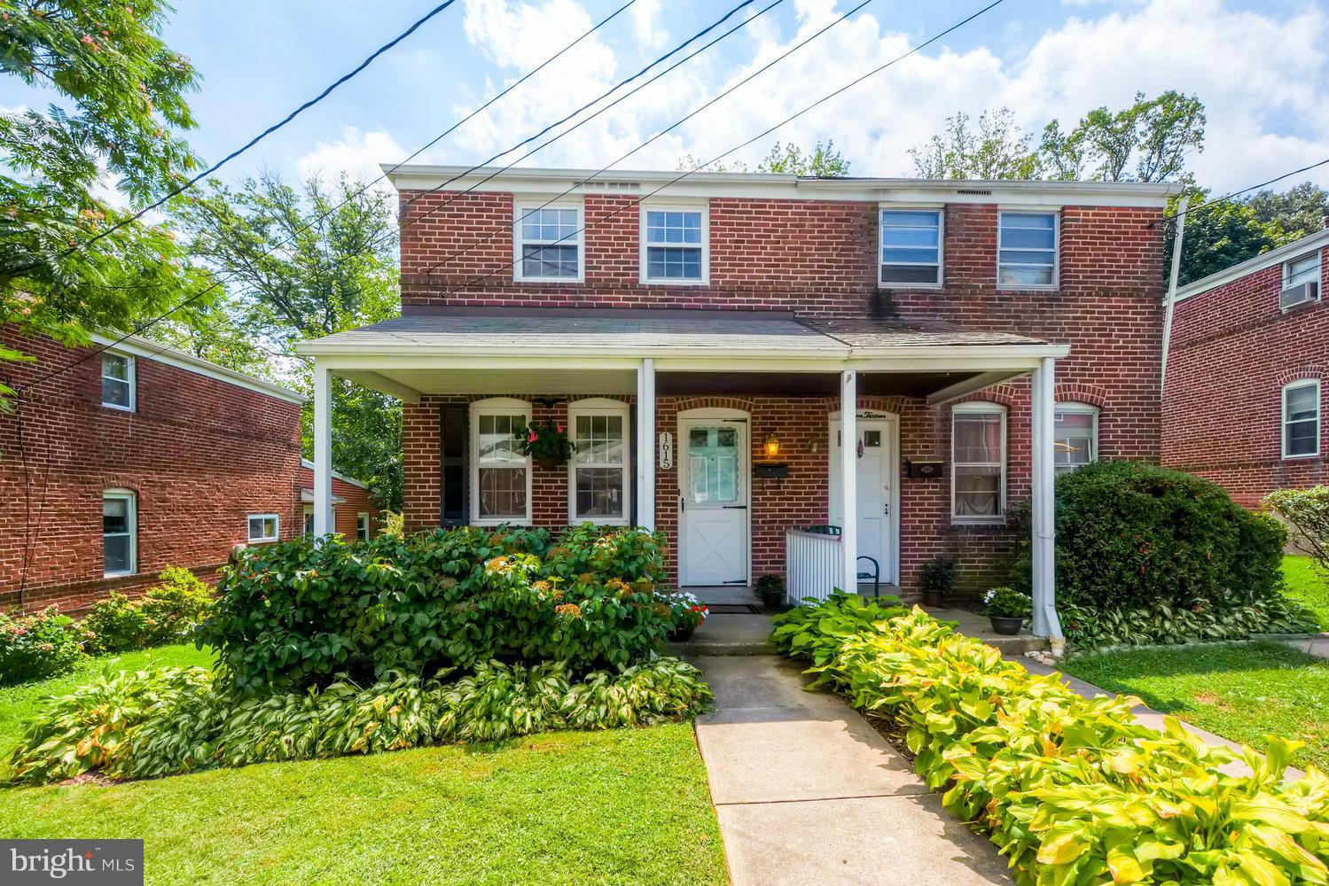 1615 Mussula Road Towson, MD 21286 - Photo 28 of 30 front view of a brick house with a yard