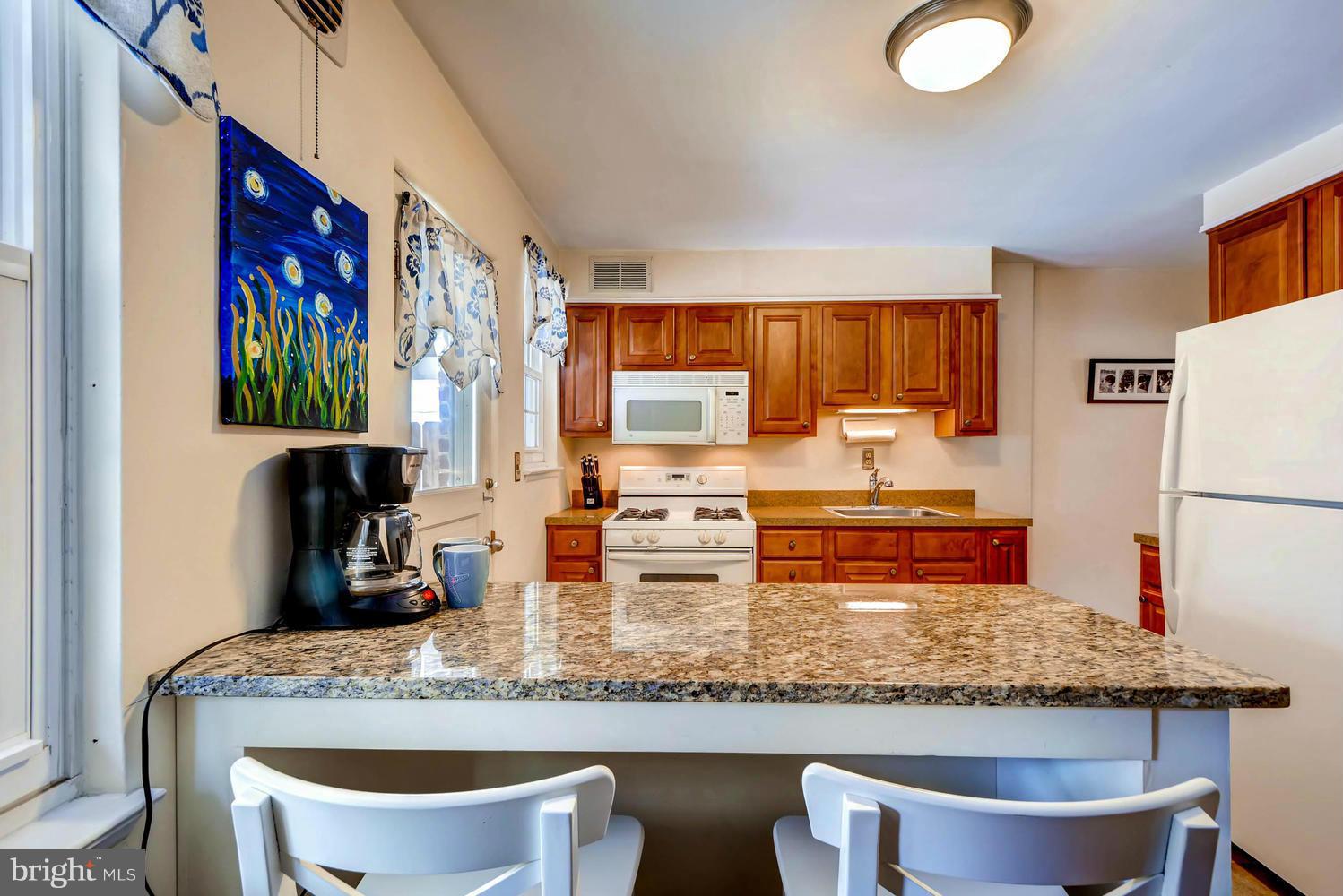 1615 Mussula Road Towson, MD 21286 - Photo 6 of 30 a kitchen with a table and chairs in it