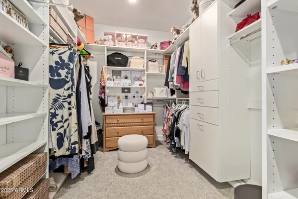 a view of a livingroom with entryway and hallway