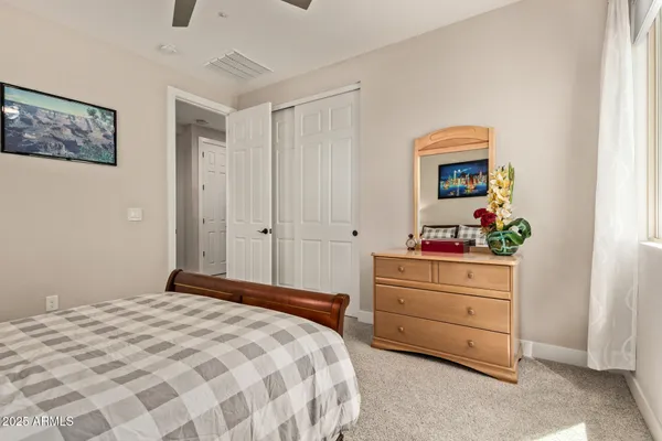 a view of a livingroom with workspace and a flat screen tv