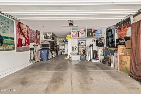 a view of a patio with a table and chairs under an umbrella