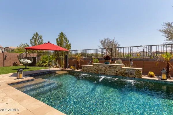 an aerial view of residential houses with outdoor space and parking