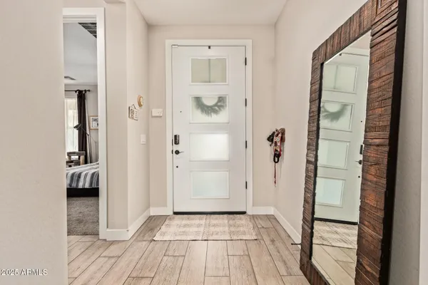a living room with furniture a chandelier and a chandelier