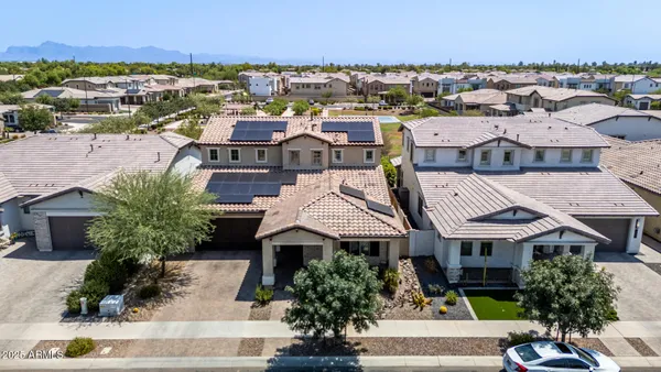 an aerial view of residential houses with outdoor space