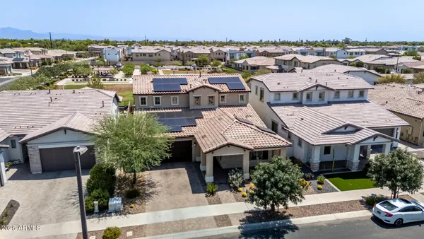 an aerial view of a house with a swimming pool