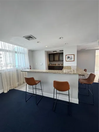 a living room with furniture and a chair