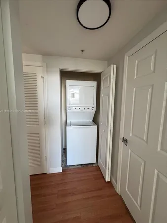 a view of a room with wooden floor and closet