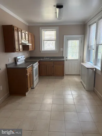a kitchen with a cabinets and window