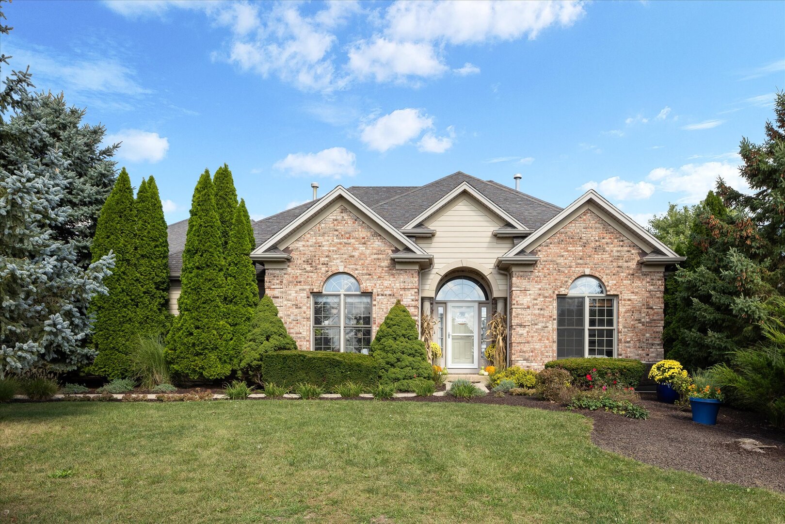 1330 Airport Road Morris, IL 60450 - Photo 1 of 53 a front view of a house with a garden and plants