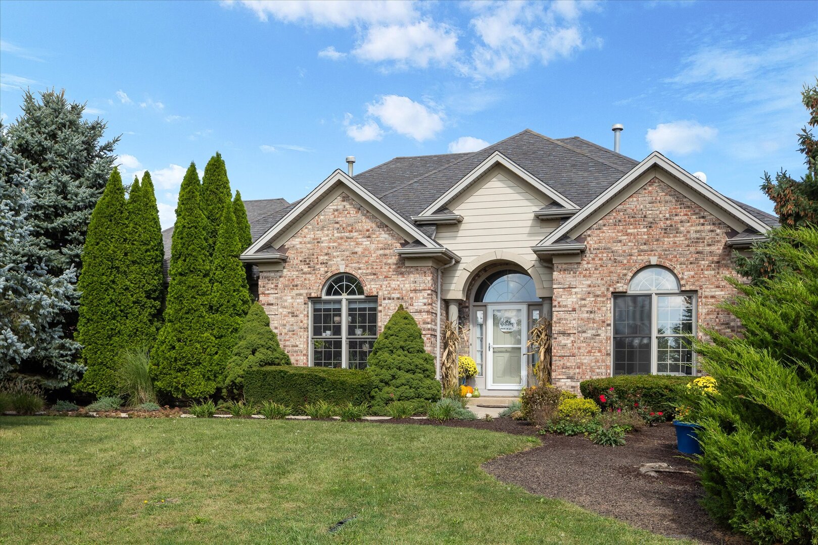 1330 Airport Road Morris, IL 60450 - Photo 2 of 53 a front view of a house with a garden