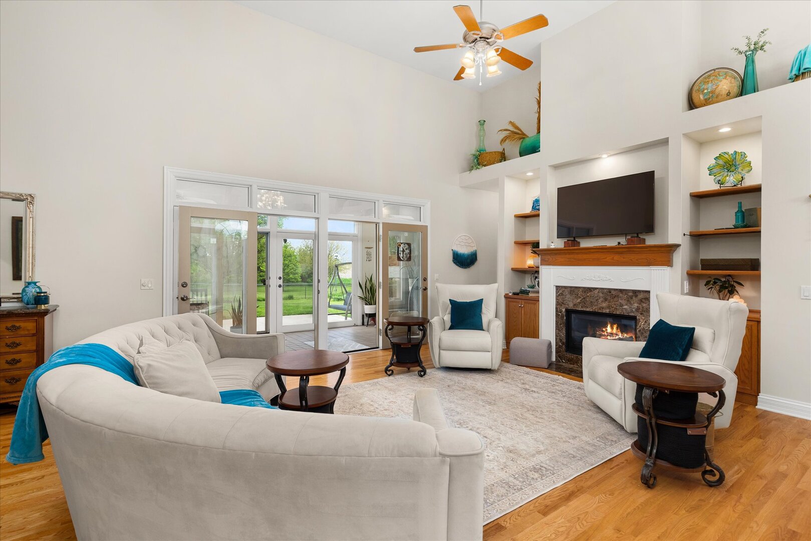 1330 Airport Road Morris, IL 60450 - Photo 26 of 53 a living room with furniture a fireplace and a flat screen tv