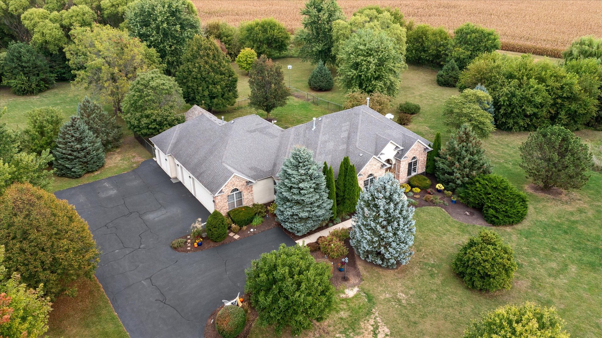 1330 Airport Road Morris, IL 60450 - Photo 47 of 53 an aerial view of a house with a yard and a garden