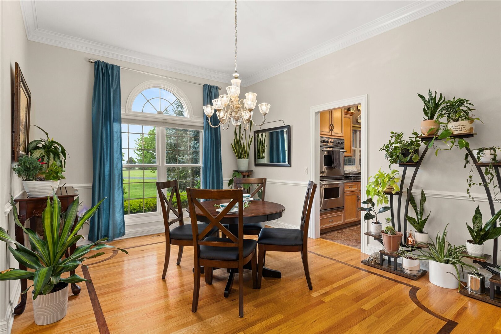 1330 Airport Road Morris, IL 60450 - Photo 6 of 53 a dining room with furniture potted plants and wooden floor