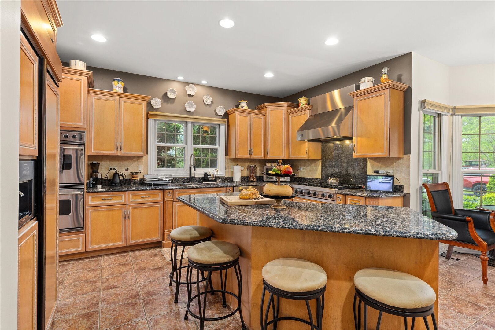 1330 Airport Road Morris, IL 60450 - Photo 9 of 53 a kitchen with stainless steel appliances granite countertop a stove a sink and a refrigerator