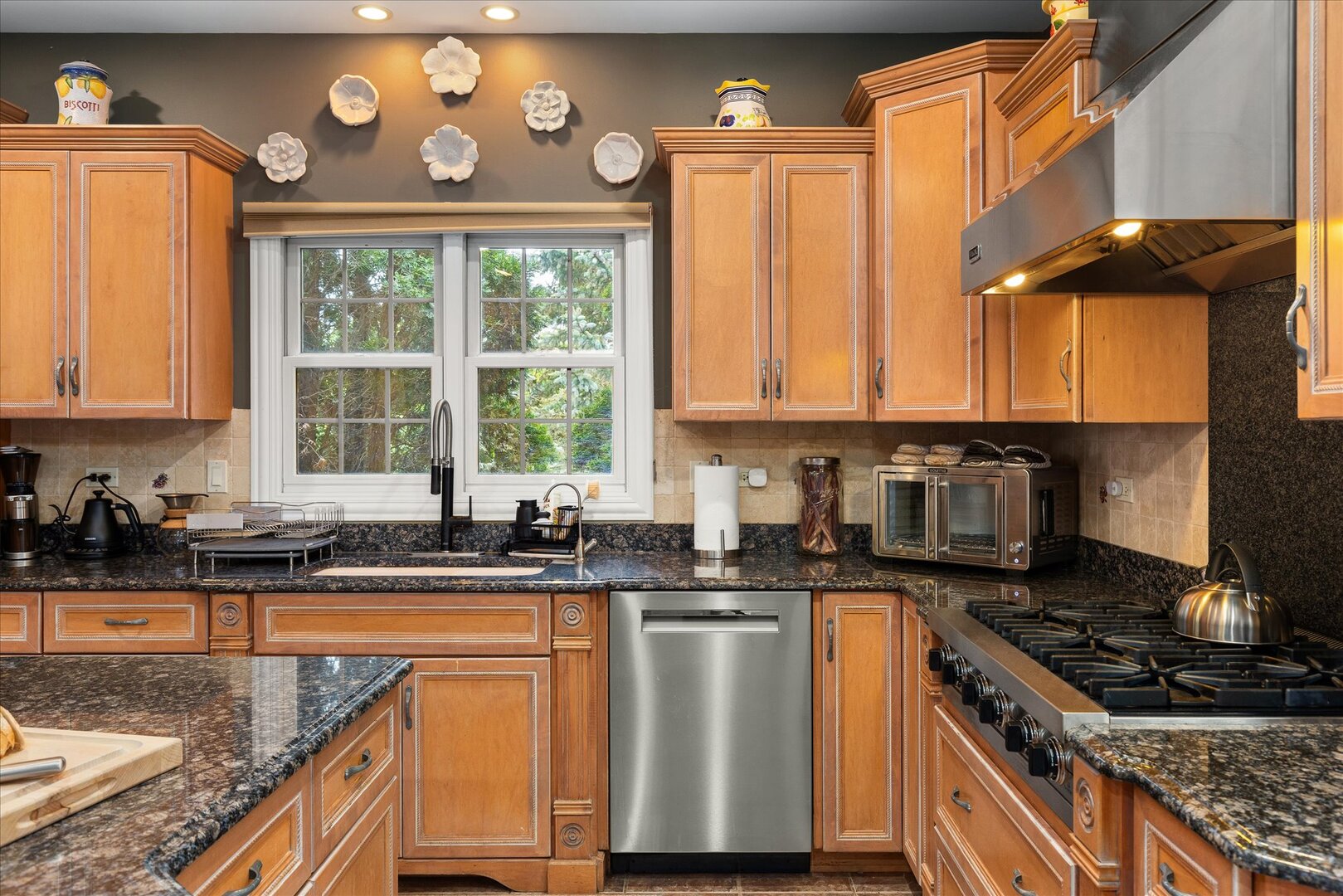 1330 Airport Road Morris, IL 60450 - Photo 10 of 53 a kitchen with stainless steel appliances granite countertop a sink stove and cabinets